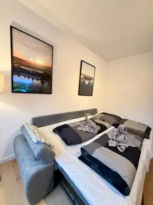 Ein Bett oder Betten in einem Zimmer der Unterkunft KO 3-Zimmer Apartment 73 qm bis zu 6 Personen