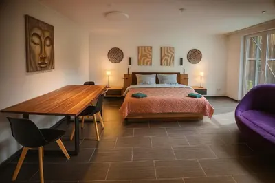 Ein Bett oder Betten in einem Zimmer der Unterkunft Luxury Amour Suite Modern Design mit Terrasse