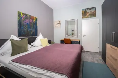 Ein Bett oder Betten in einem Zimmer der Unterkunft Rheinzeit Koblenz