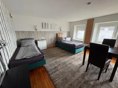 Ein Bett oder Betten in einem Zimmer der Unterkunft Gusenburg H 14 für bis 8 Personen Monteurwohnung