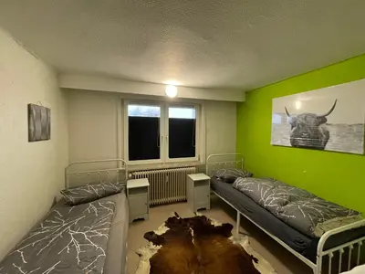 Ein Bett oder Betten in einem Zimmer der Unterkunft Gusenburg K 23 bis 10 Personen Monteur Wohnung