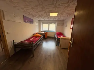 Ein Bett oder Betten in einem Zimmer der Unterkunft Gusenburg B13u Monteur Unterkunft bis 8 Personen