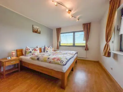 Ein Bett oder Betten in einem Zimmer der Unterkunft Eifelleben Kleinlangenfeld