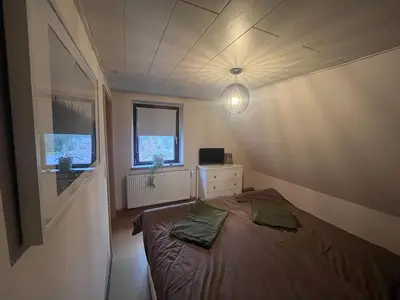 Ein Bett oder Betten in einem Zimmer der Unterkunft Familienhaus für 6 Personen