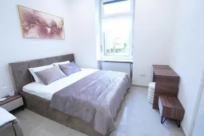 Ein Bett oder Betten in einem Zimmer der Unterkunft Luxury Apartments - Wohnung IC - Luxus-Apartment
