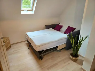 Ein Bett oder Betten in einem Zimmer der Unterkunft Ferienhäuschen in Dickesbach