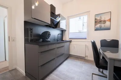Küche/Küchenzeile in der Unterkunft STAYDIA Zentrales Apartment nahe Münzplatz