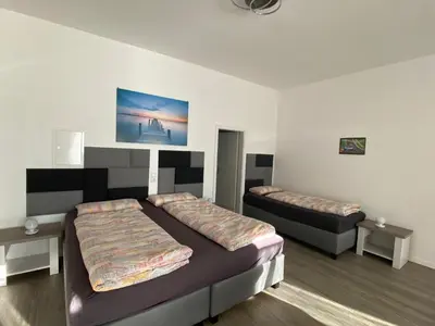 Ein Bett oder Betten in einem Zimmer der Unterkunft Race & Rest Apartments