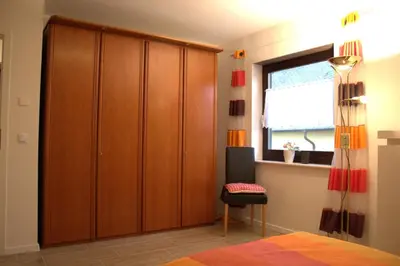 Ein Bett oder Betten in einem Zimmer der Unterkunft Moderne Ferienwohnung in Mastershausen - 140qm