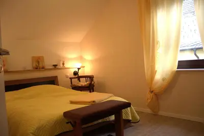Ein Bett oder Betten in einem Zimmer der Unterkunft Moderne Ferienwohnung in Mastershausen - 140qm