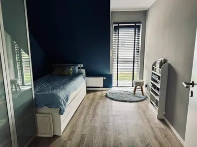 Ein Bett oder Betten in einem Zimmer der Unterkunft Große Doppelhaushälfte mit Sauna, Pool & Garten