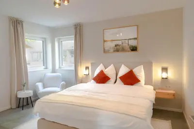 Ein Bett oder Betten in einem Zimmer der Unterkunft Premiumzeit Apartments Bostalsee - Whirlpool, Sauna