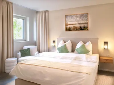 Ein Bett oder Betten in einem Zimmer der Unterkunft Premiumzeit Pure Apartment Bostalsee mit Infrarotkabine