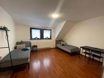 Ein Bett oder Betten in einem Zimmer der Unterkunft Ruhige Dachgeschosswohnung in Nickenich