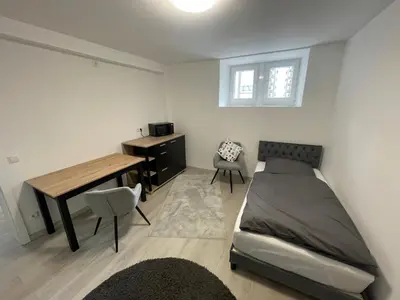 Ein Bett oder Betten in einem Zimmer der Unterkunft ABC Ferienwohnung Zimmer mit Kochmöglichkeit