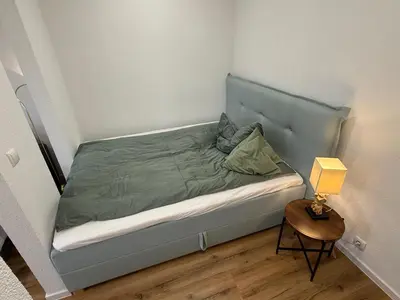 Ein Bett oder Betten in einem Zimmer der Unterkunft R&A Appartments
