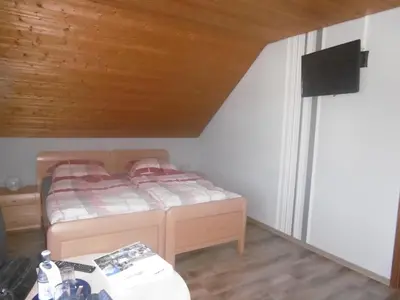 Ein Bett oder Betten in einem Zimmer der Unterkunft Haus Hochwaldhöhe