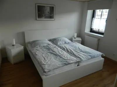 Ein Bett oder Betten in einem Zimmer der Unterkunft Ferienwohnung Bretz