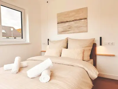 Ein Bett oder Betten in einem Zimmer der Unterkunft Eulennest Tiny House mit Whirlpool und Sauna