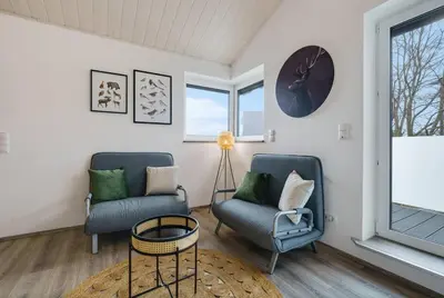 Ein Sitzbereich in der Unterkunft Wunderschönes Ferienhaus im Grünen
