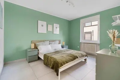 Ein Bett oder Betten in einem Zimmer der Unterkunft Moderne Traumwohnung mit Traumgarten