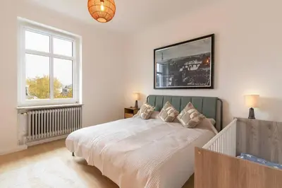 Ein Bett oder Betten in einem Zimmer der Unterkunft Altbauwohnung in Mayen im Grünen