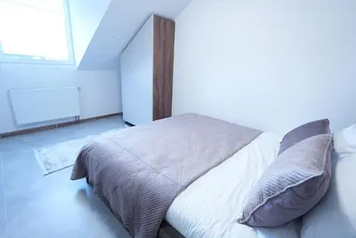 Ein Bett oder Betten in einem Zimmer der Unterkunft Luxury Apartments - Wohnung IA - Modernes Twin-Apartment