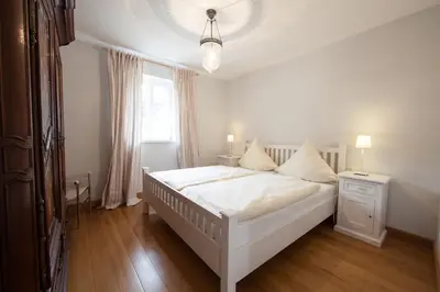 Ein Bett oder Betten in einem Zimmer der Unterkunft Weingut & Gästehaus GiwerGreif