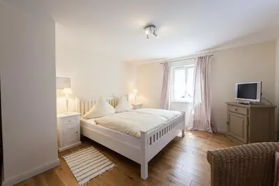 Ein Bett oder Betten in einem Zimmer der Unterkunft Weingut & Gästehaus GiwerGreif