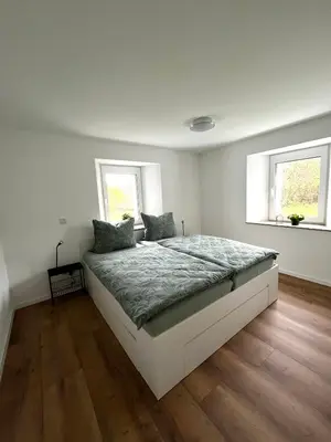 Ein Bett oder Betten in einem Zimmer der Unterkunft Ferienwohnung Martha und Nikla