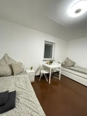 Ein Bett oder Betten in einem Zimmer der Unterkunft Gemütliches DG-Apartment in Weißenthurm, Wohnung 4