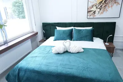 Ein Bett oder Betten in einem Zimmer der Unterkunft Luxury Apartments - Wohnung IC - Familienfreundliches