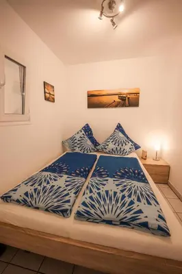 Ein Bett oder Betten in einem Zimmer der Unterkunft Ferienwohnung Keppeln