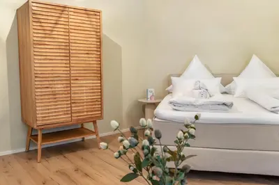 Ein Bett oder Betten in einem Zimmer der Unterkunft RheinGold Apartment I Bingen City
