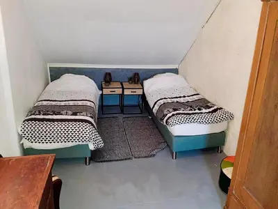 Ein Bett oder Betten in einem Zimmer der Unterkunft Eifel Garden Villa for Groups
