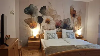 Ein Bett oder Betten in einem Zimmer der Unterkunft Am Laacher Wald
