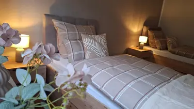 Ein Bett oder Betten in einem Zimmer der Unterkunft Am Laacher Wald