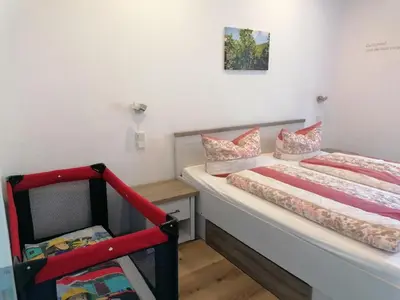 Ein Bett oder Betten in einem Zimmer der Unterkunft Ferienwohnungen Felten in Minheim