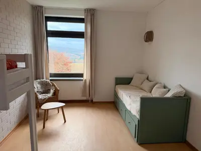 Ein Bett oder Betten in einem Zimmer der Unterkunft Waldherberge Sargenroth