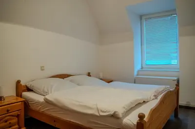 Ein Bett oder Betten in einem Zimmer der Unterkunft Mosella FeWo