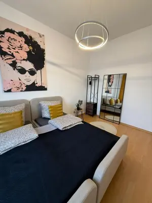 Ein Bett oder Betten in einem Zimmer der Unterkunft Koblenz City - 3-Zimmer Apartment an der Balduinbrücke