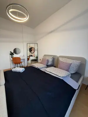 Ein Bett oder Betten in einem Zimmer der Unterkunft Koblenz City - 3-Zimmer Apartment an der Balduinbrücke
