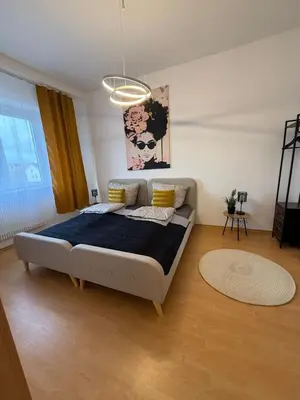Ein Bett oder Betten in einem Zimmer der Unterkunft Koblenz City - 3-Zimmer Apartment an der Balduinbrücke