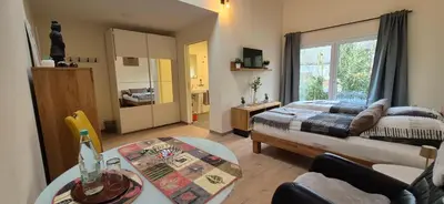 Ein Bett oder Betten in einem Zimmer der Unterkunft Gästehaus Hähnchenbach