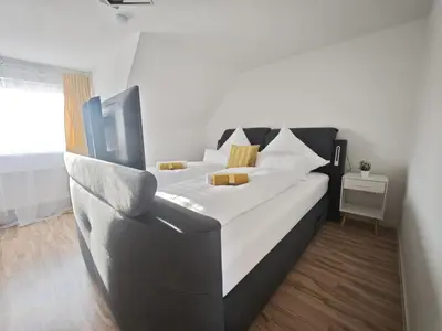 Ein Bett oder Betten in einem Zimmer der Unterkunft DANESSI Urlaub Business nahe Industriegebiet und Koblenz 2 OG