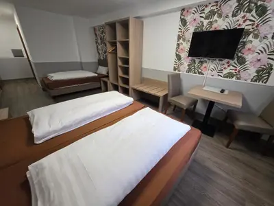 Ein Bett oder Betten in einem Zimmer der Unterkunft Hotel Montag