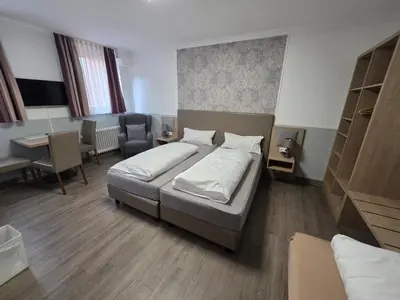Ein Bett oder Betten in einem Zimmer der Unterkunft Hotel Montag