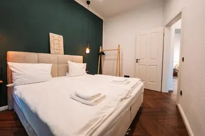 Ein Bett oder Betten in einem Zimmer der Unterkunft Stylisches Apartment mit Schlafzimmer & Wohnzimmer