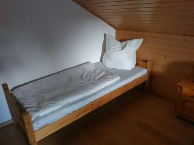 Ein Bett oder Betten in einem Zimmer der Unterkunft Dorfschönheit