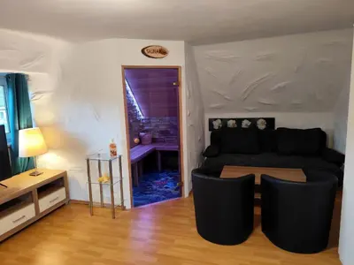 Ein Sitzbereich in der Unterkunft Holiday Home City FH Vulkaneinfel by Interhome